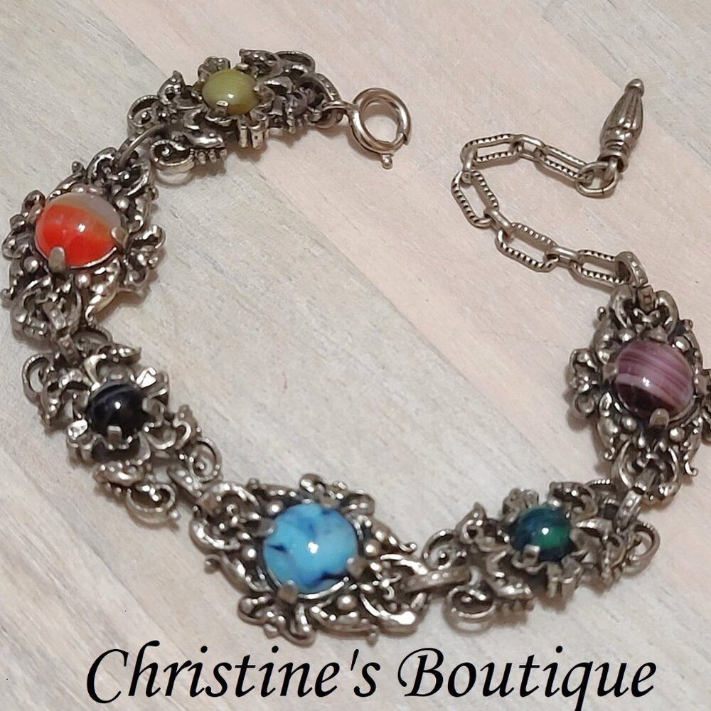 Vintage ornate bracelet, with multi color cabachons and filigree metal